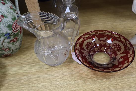 An early Victorian glass water jug, three Regency decanters and a Bohemian ruby glass bowl (5)